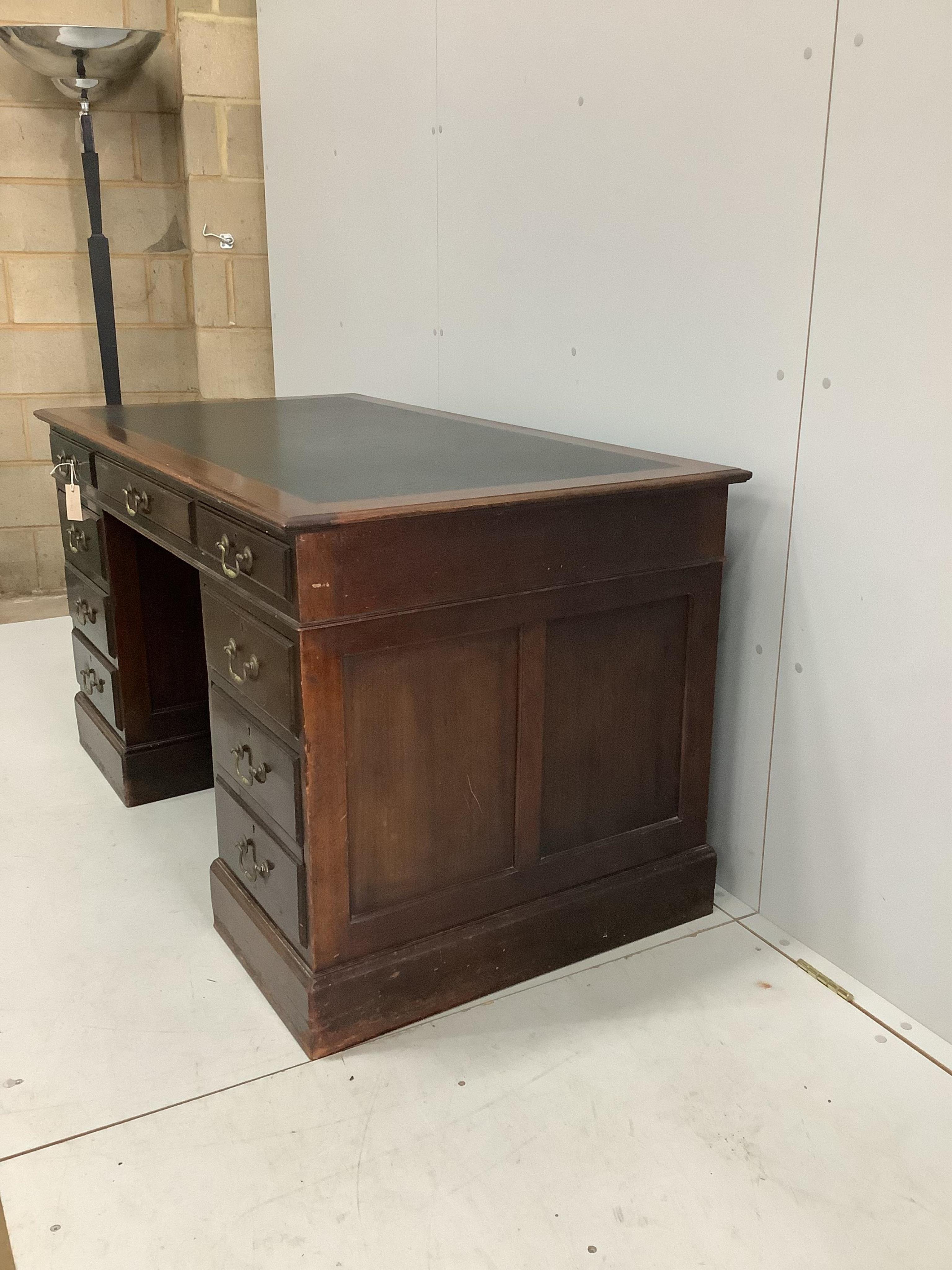 An Edwardian mahogany pedestal desk, width 137cm, depth 76cm, height 77cm. Condition - fair